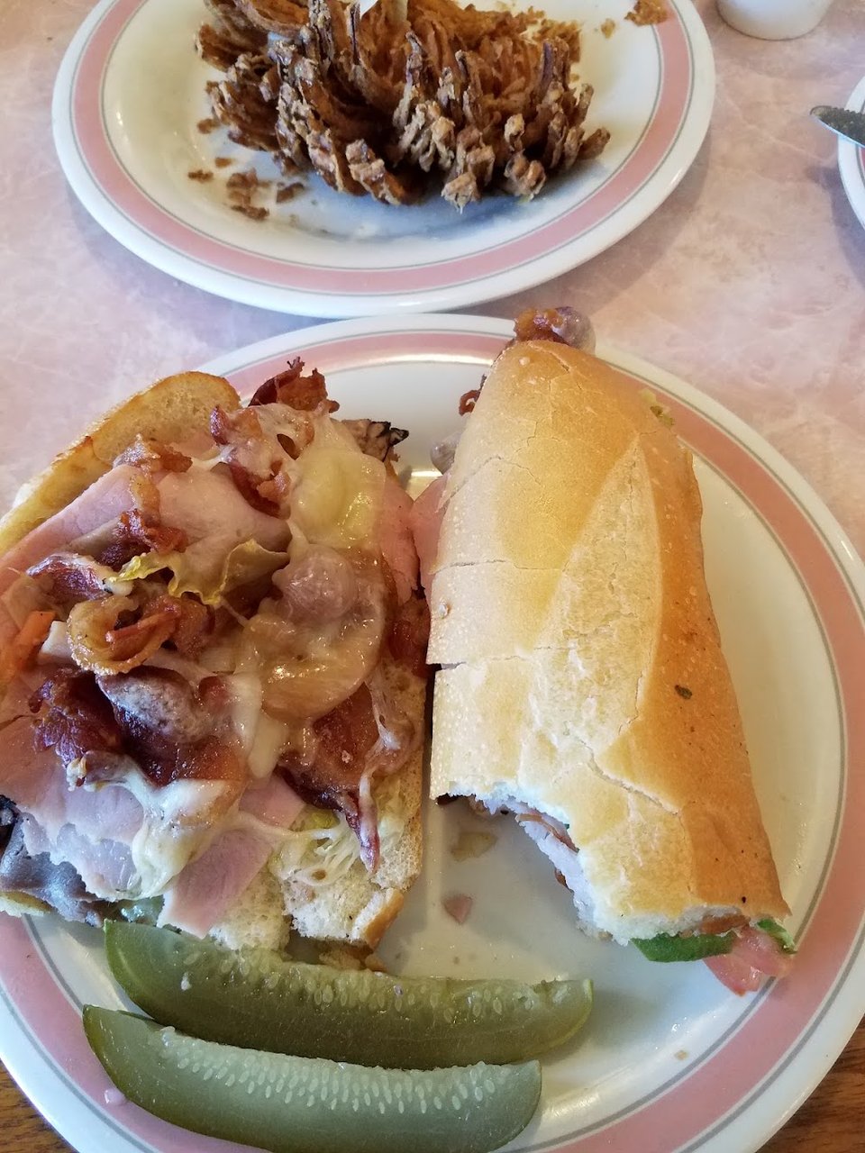 Printed menu showing hot oven subs.