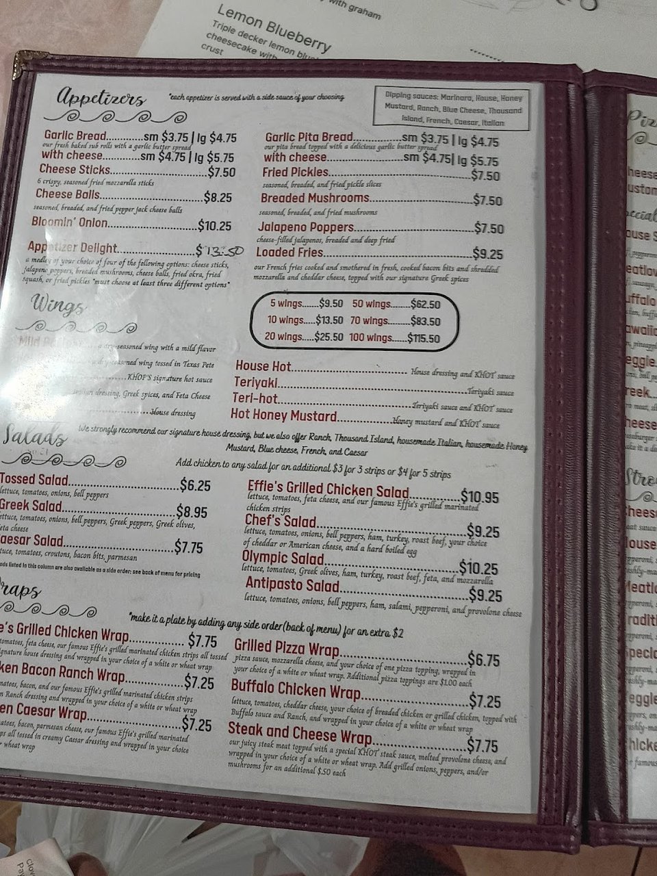 Close-up of restaurant menu categories.